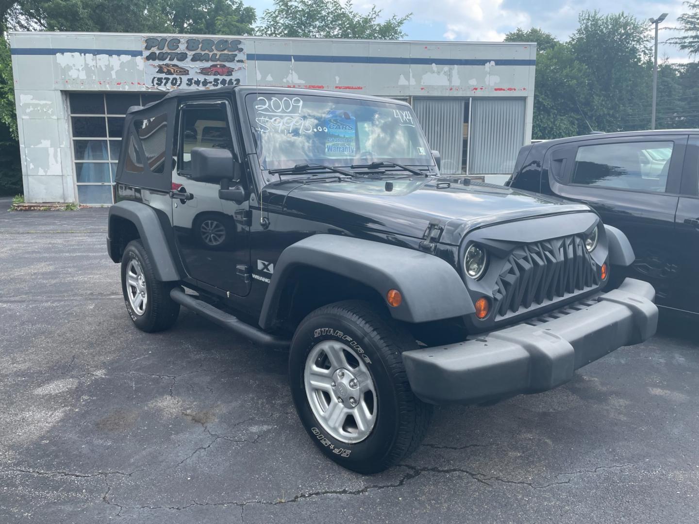 2009 black Jeep Wrangler X (1J4FA24159L) with an 3.8L V6 OHV 12V engine, located at 101 N. Main Street, Muncy, PA, 17756, (570) 546-5462, 41.207691, -76.785942 - Photo#0