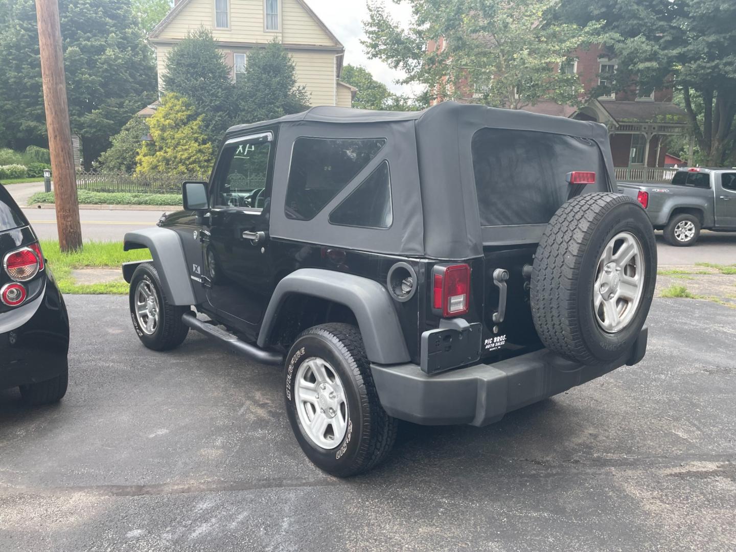 2009 black Jeep Wrangler X (1J4FA24159L) with an 3.8L V6 OHV 12V engine, located at 101 N. Main Street, Muncy, PA, 17756, (570) 546-5462, 41.207691, -76.785942 - Photo#2