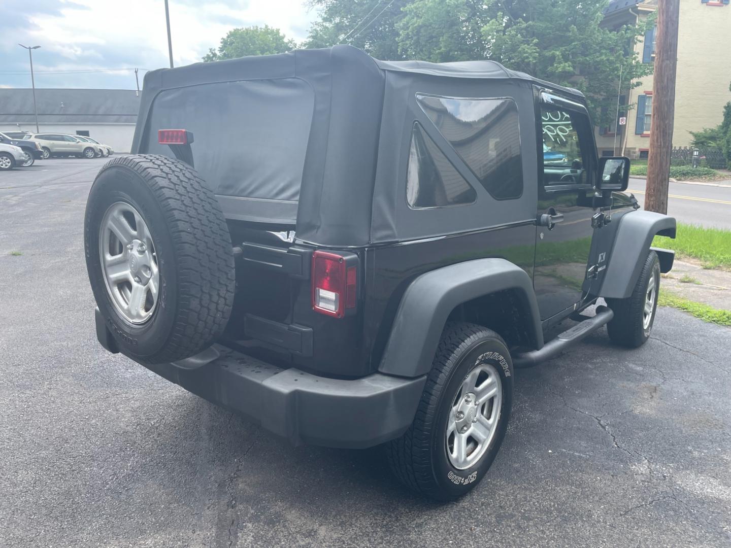 2009 black Jeep Wrangler X (1J4FA24159L) with an 3.8L V6 OHV 12V engine, located at 101 N. Main Street, Muncy, PA, 17756, (570) 546-5462, 41.207691, -76.785942 - Photo#3