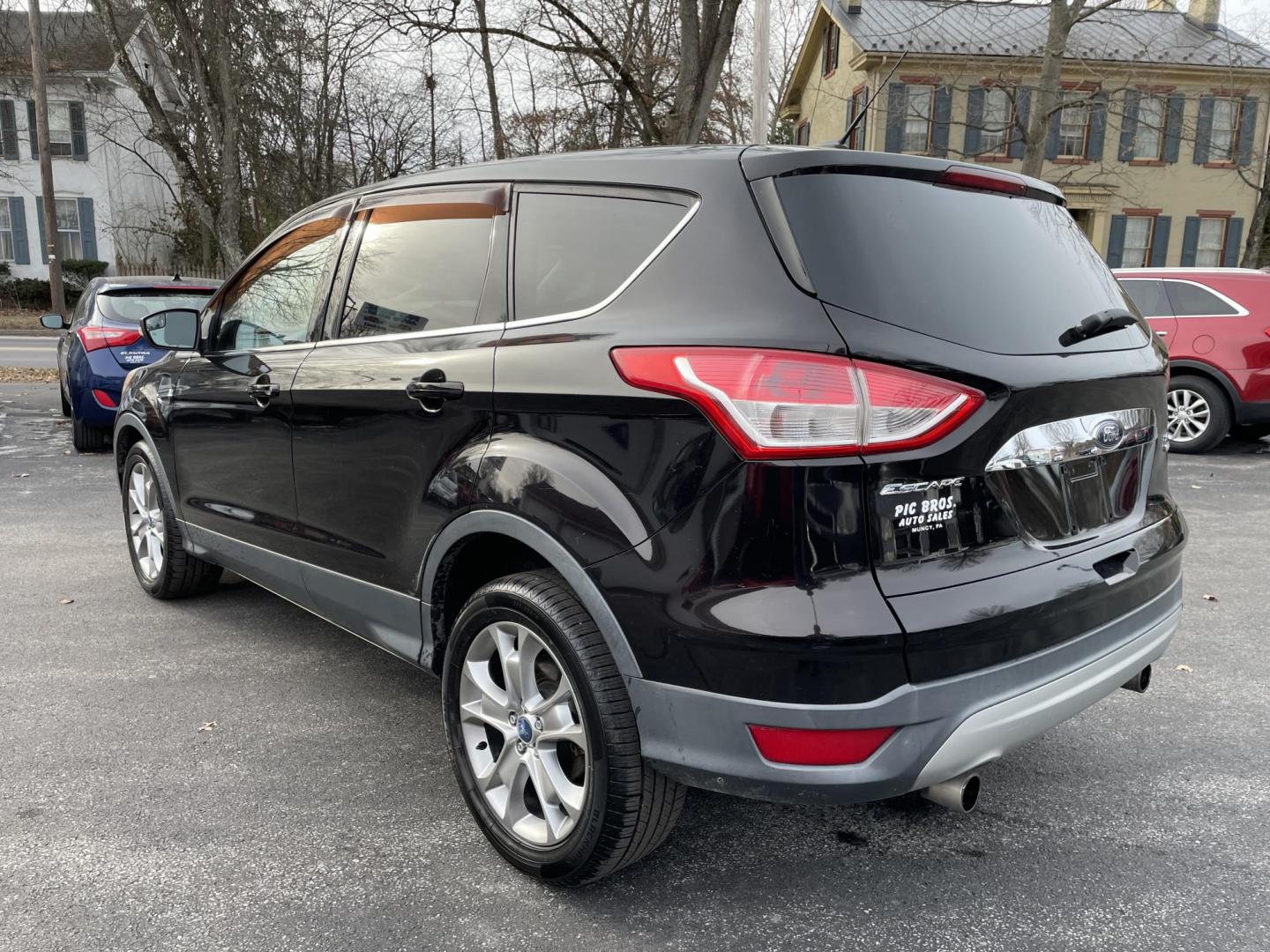 2013 black Ford Escape SEL AWD (1FMCU9HX4DU) with an 1.6L L4 DOHC 16V engine, 6-Speed Automatic transmission, located at 101 N. Main Street, Muncy, PA, 17756, (570) 546-5462, 41.207691, -76.785942 - Photo#2