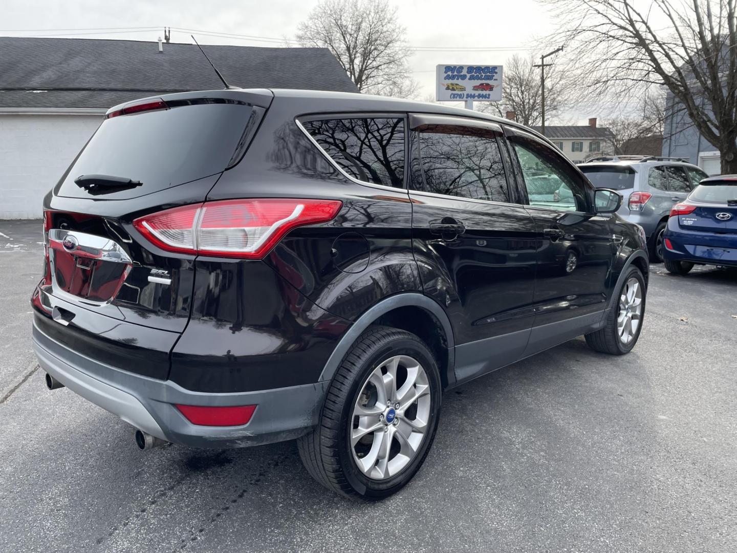 2013 black Ford Escape SEL AWD (1FMCU9HX4DU) with an 1.6L L4 DOHC 16V engine, 6-Speed Automatic transmission, located at 101 N. Main Street, Muncy, PA, 17756, (570) 546-5462, 41.207691, -76.785942 - Photo#3