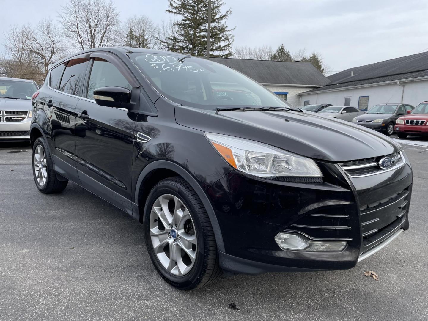 2013 black Ford Escape SEL AWD (1FMCU9HX4DU) with an 1.6L L4 DOHC 16V engine, 6-Speed Automatic transmission, located at 101 N. Main Street, Muncy, PA, 17756, (570) 546-5462, 41.207691, -76.785942 - Photo#1