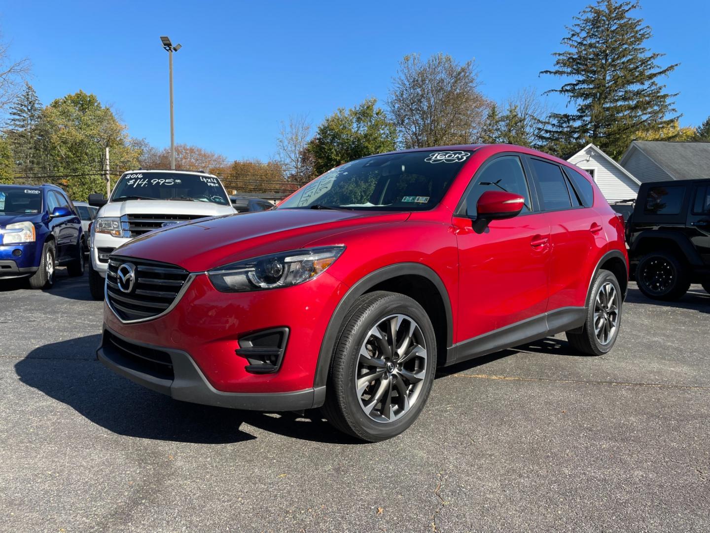 2016 Red Mazda CX-5 Grand Touring AWD (JM3KE4DY0G0) with an 2.5L L4 DOHC 16V engine, 6-Speed Automatic transmission, located at 101 N. Main Street, Muncy, PA, 17756, (570) 546-5462, 41.207691, -76.785942 - Photo#0