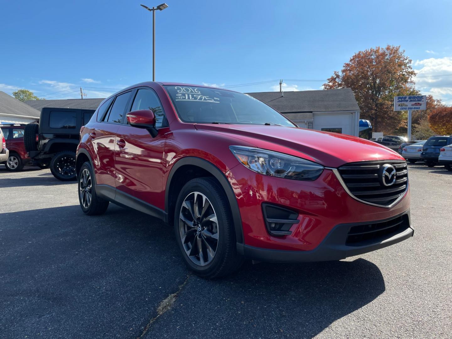 2016 Red Mazda CX-5 Grand Touring AWD (JM3KE4DY0G0) with an 2.5L L4 DOHC 16V engine, 6-Speed Automatic transmission, located at 101 N. Main Street, Muncy, PA, 17756, (570) 546-5462, 41.207691, -76.785942 - Photo#1