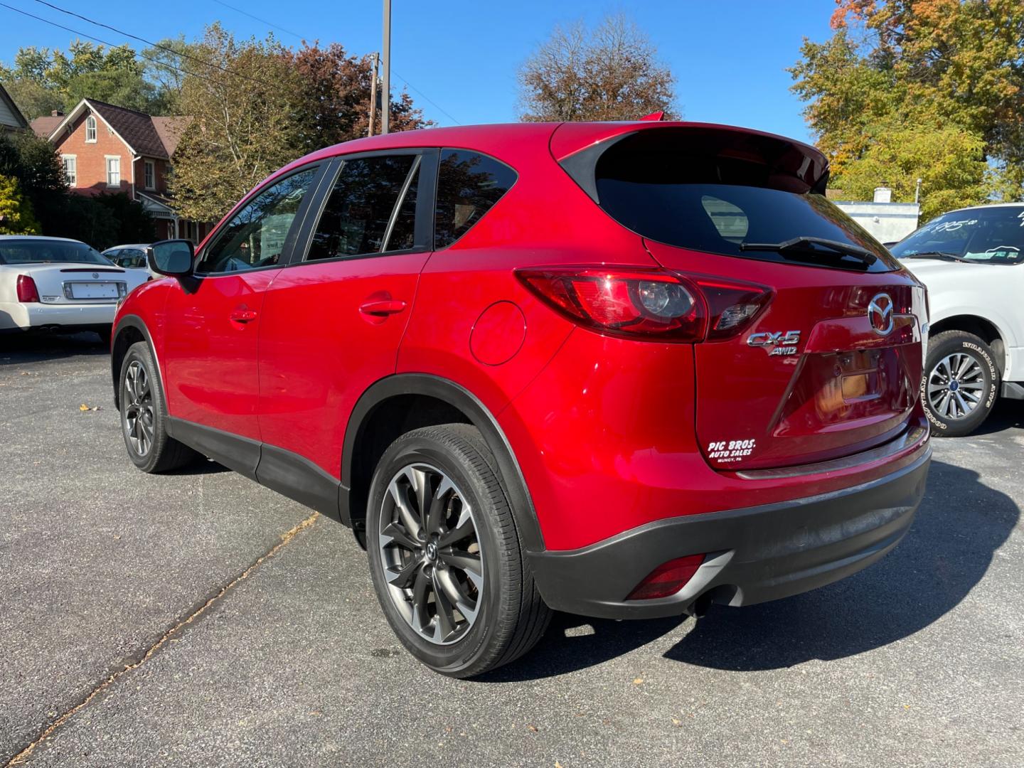 2016 Red Mazda CX-5 Grand Touring AWD (JM3KE4DY0G0) with an 2.5L L4 DOHC 16V engine, 6-Speed Automatic transmission, located at 101 N. Main Street, Muncy, PA, 17756, (570) 546-5462, 41.207691, -76.785942 - Photo#2