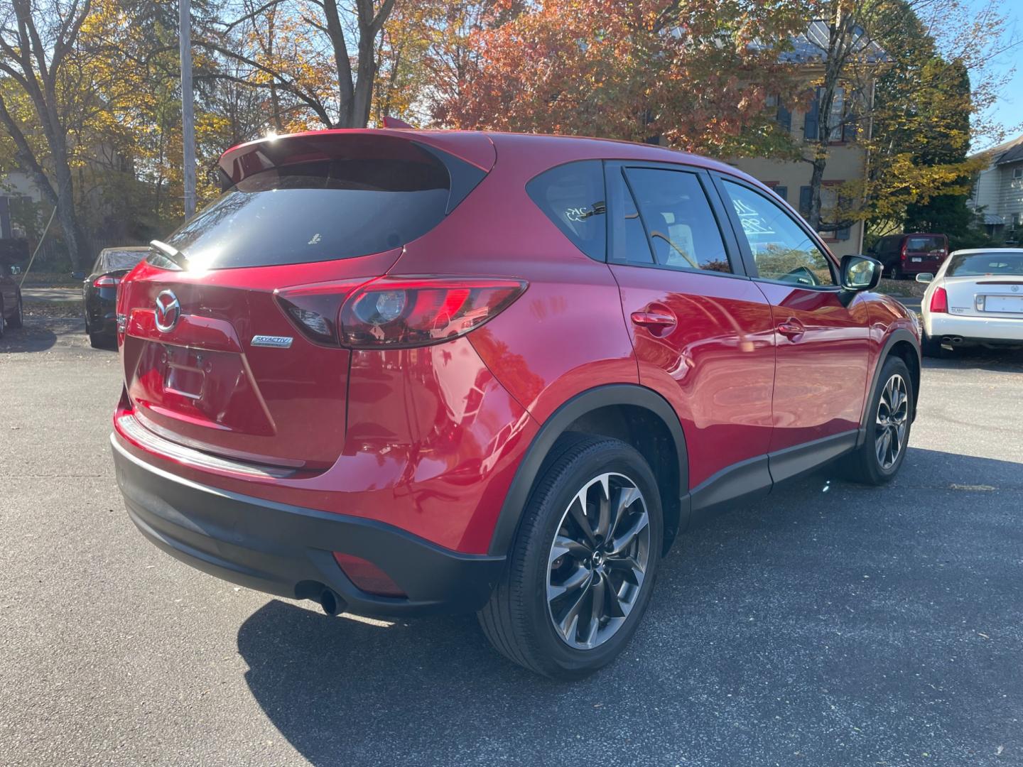 2016 Red Mazda CX-5 Grand Touring AWD (JM3KE4DY0G0) with an 2.5L L4 DOHC 16V engine, 6-Speed Automatic transmission, located at 101 N. Main Street, Muncy, PA, 17756, (570) 546-5462, 41.207691, -76.785942 - Photo#3