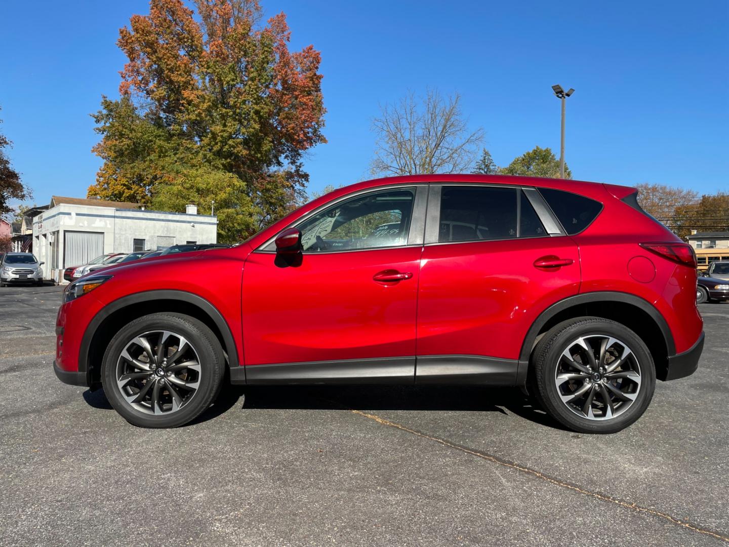 2016 Red Mazda CX-5 Grand Touring AWD (JM3KE4DY0G0) with an 2.5L L4 DOHC 16V engine, 6-Speed Automatic transmission, located at 101 N. Main Street, Muncy, PA, 17756, (570) 546-5462, 41.207691, -76.785942 - Photo#4