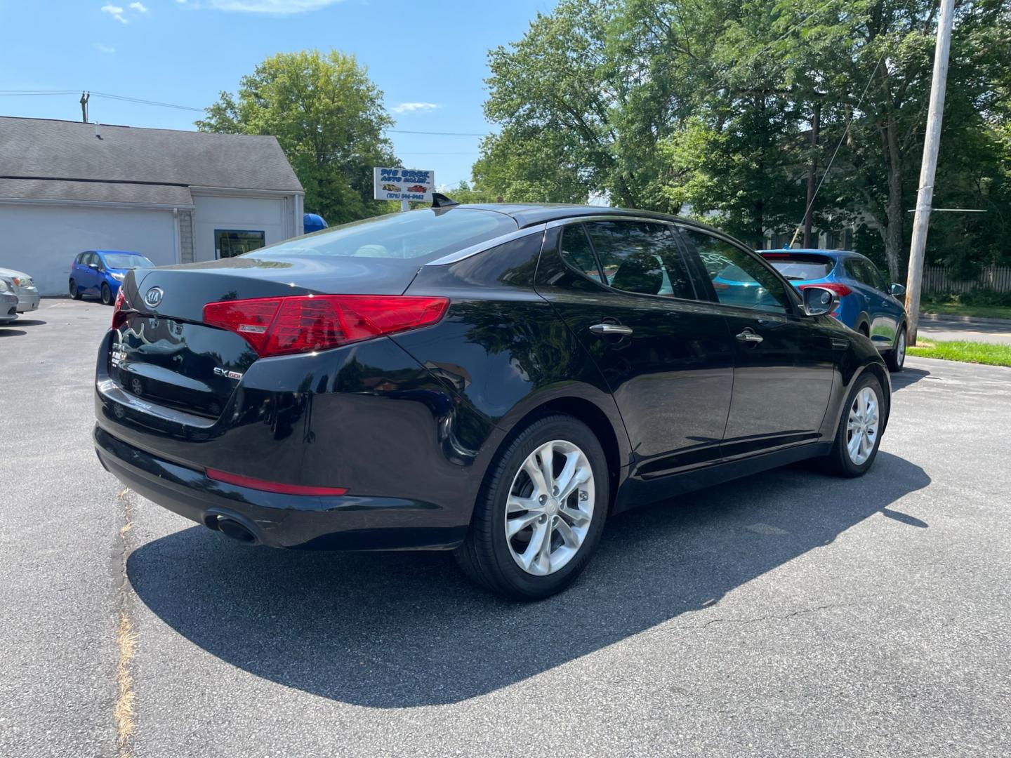 2012 black Kia Optima EX (5XXGN4A77CG) with an 2.4L L4 DOHC 16V engine, 6-Speed Automatic transmission, located at 101 N. Main Street, Muncy, PA, 17756, (570) 546-5462, 41.207691, -76.785942 - Photo#2