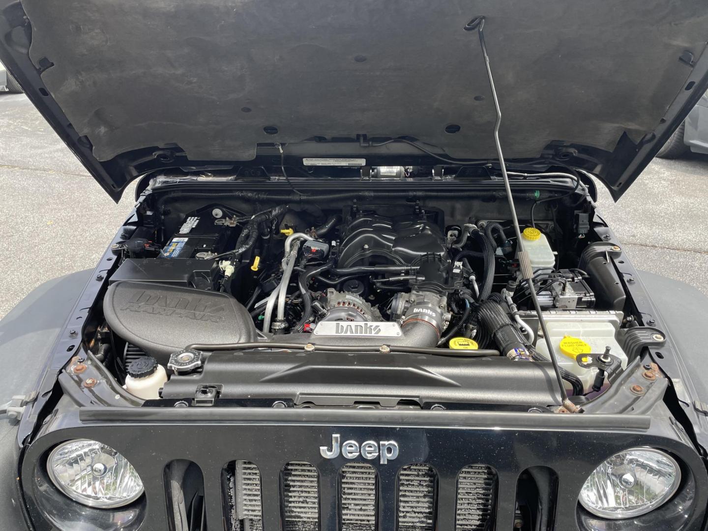 2012 black Jeep Wrangler Unlimited Rubicon 4WD (1C4BJWFG6CL) with an 3.6L V6 DOHC 24V FFV engine, located at 101 N. Main Street, Muncy, PA, 17756, (570) 546-5462, 41.207691, -76.785942 - Photo#7