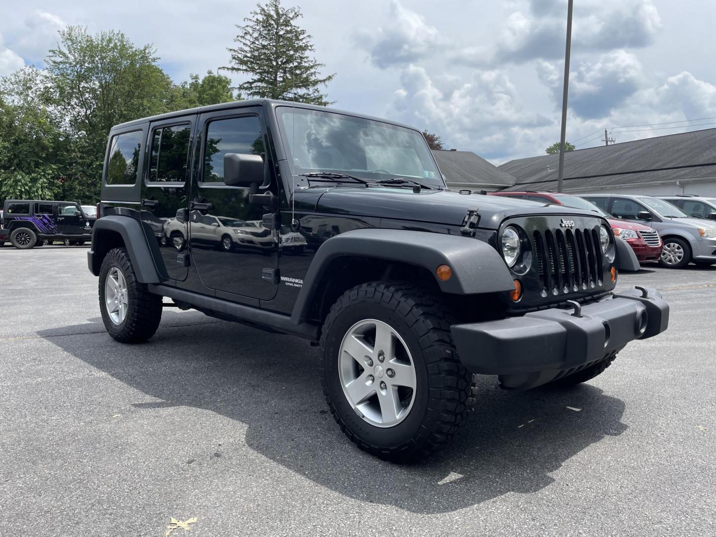 2012 black Jeep Wrangler Unlimited Rubicon 4WD (1C4BJWFG6CL) with an 3.6L V6 DOHC 24V FFV engine, located at 101 N. Main Street, Muncy, PA, 17756, (570) 546-5462, 41.207691, -76.785942 - Photo#1