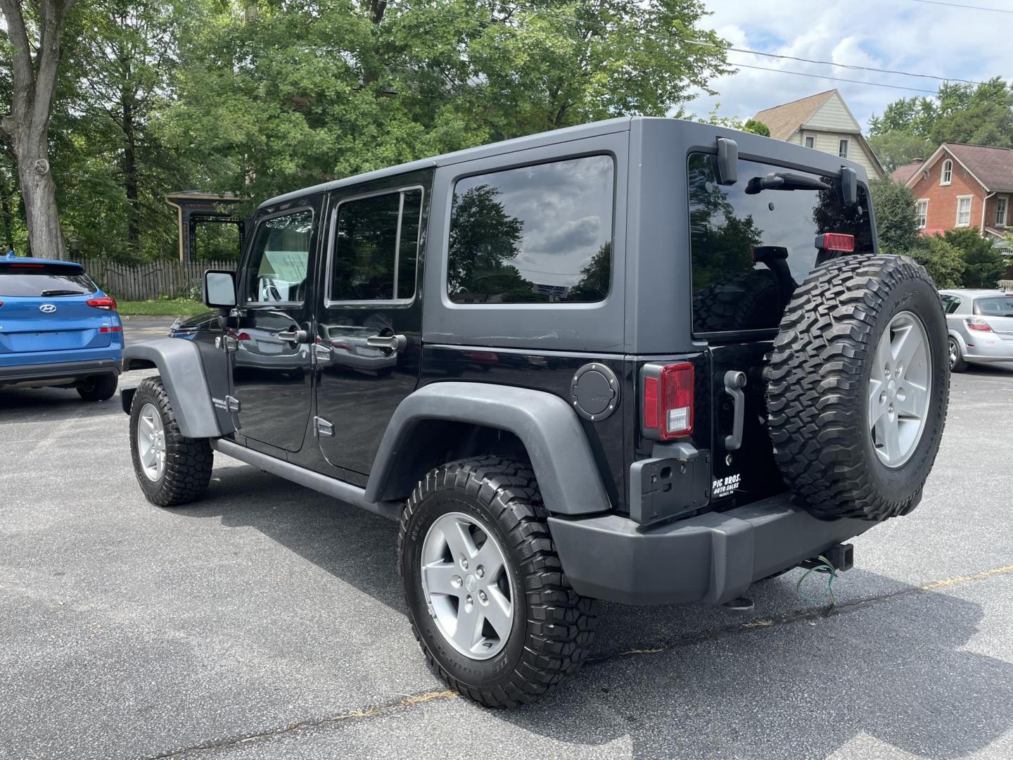 2012 black Jeep Wrangler Unlimited Rubicon 4WD (1C4BJWFG6CL) with an 3.6L V6 DOHC 24V FFV engine, located at 101 N. Main Street, Muncy, PA, 17756, (570) 546-5462, 41.207691, -76.785942 - Photo#2