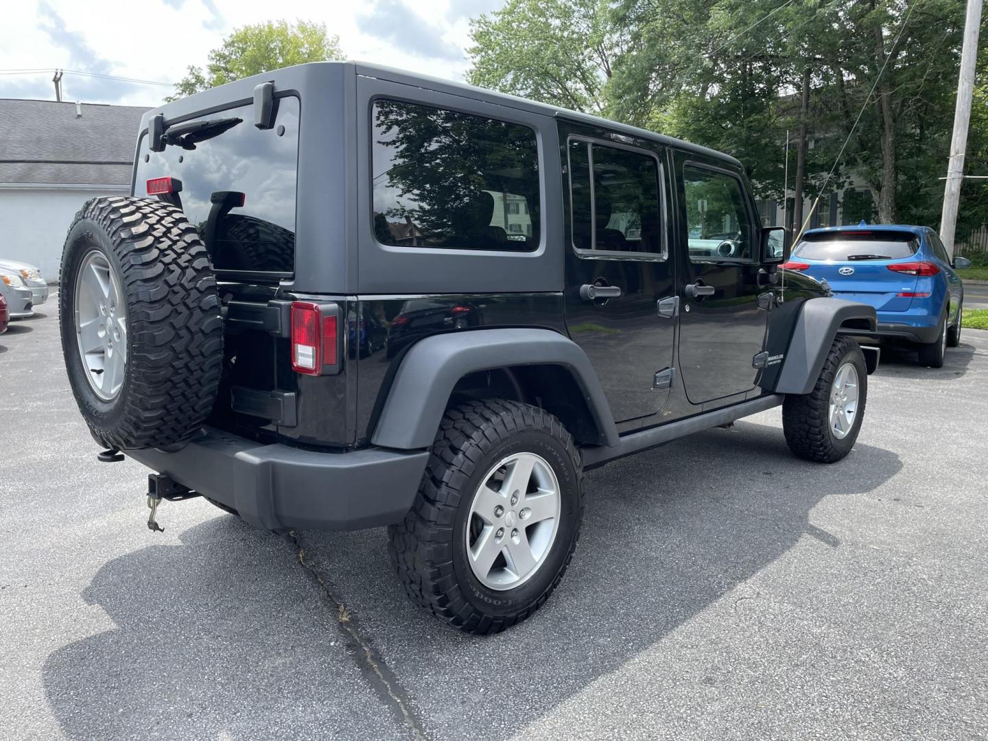 2012 black Jeep Wrangler Unlimited Rubicon 4WD (1C4BJWFG6CL) with an 3.6L V6 DOHC 24V FFV engine, located at 101 N. Main Street, Muncy, PA, 17756, (570) 546-5462, 41.207691, -76.785942 - Photo#3