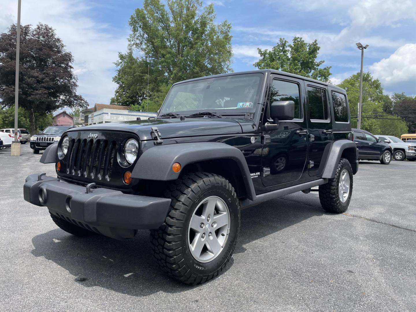 2012 black Jeep Wrangler Unlimited Rubicon 4WD (1C4BJWFG6CL) with an 3.6L V6 DOHC 24V FFV engine, located at 101 N. Main Street, Muncy, PA, 17756, (570) 546-5462, 41.207691, -76.785942 - Photo#0