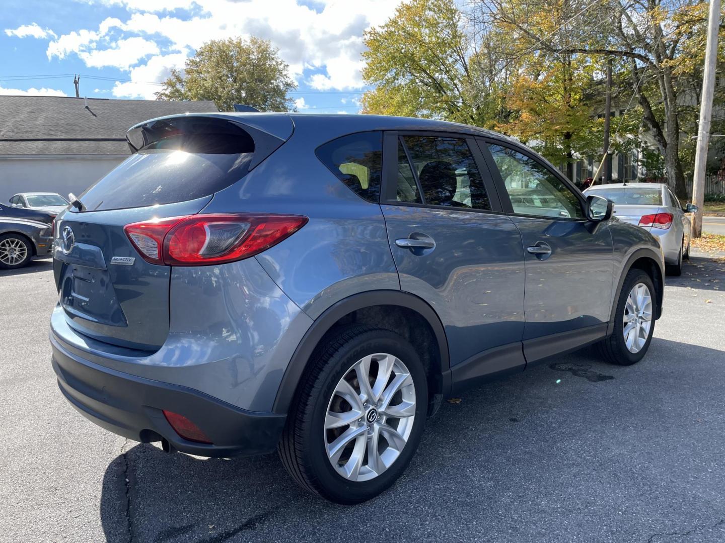 2015 blue Mazda CX-5 Grand Touring AWD (JM3KE4DY4F0) with an 2.5L L4 DOHC 16V engine, 6-Speed Automatic transmission, located at 101 N. Main Street, Muncy, PA, 17756, (570) 546-5462, 41.207691, -76.785942 - Photo#3