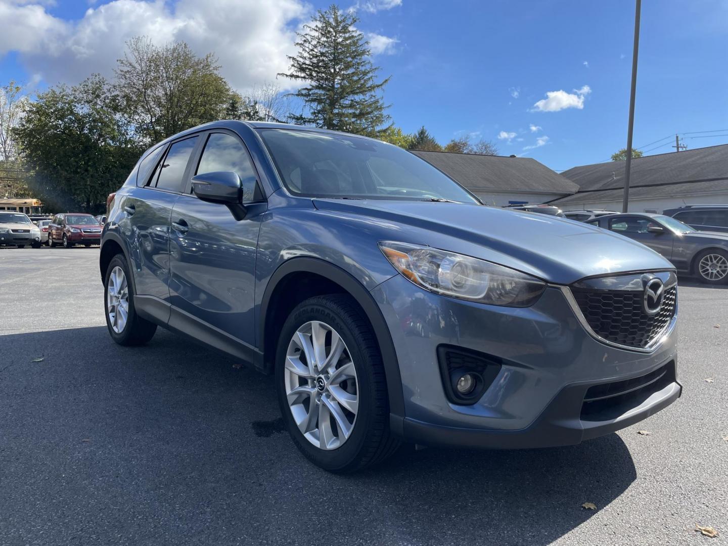 2015 blue Mazda CX-5 Grand Touring AWD (JM3KE4DY4F0) with an 2.5L L4 DOHC 16V engine, 6-Speed Automatic transmission, located at 101 N. Main Street, Muncy, PA, 17756, (570) 546-5462, 41.207691, -76.785942 - Photo#1