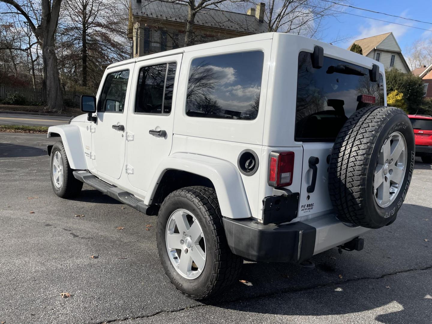 2012 Jeep Wrangler Unlimited Sahara 4WD (1C4BJWEG7CL) with an 3.6L V6 DOHC 24V FFV engine, located at 101 N. Main Street, Muncy, PA, 17756, (570) 546-5462, 41.207691, -76.785942 - Photo#2