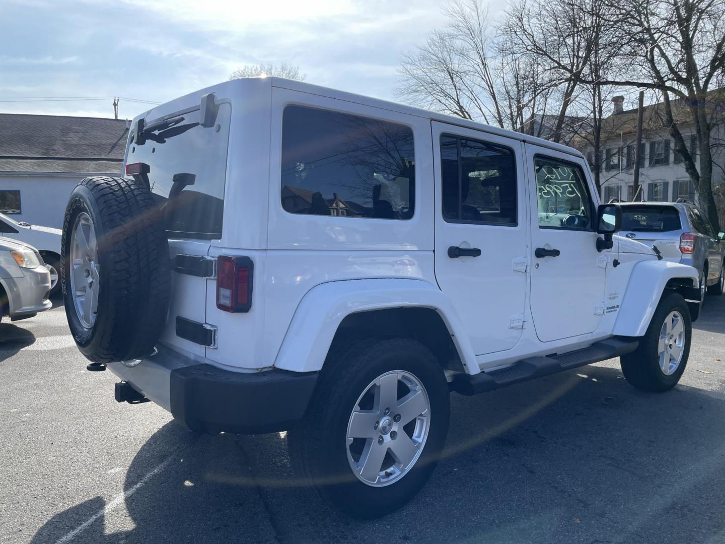 2012 Jeep Wrangler Unlimited Sahara 4WD (1C4BJWEG7CL) with an 3.6L V6 DOHC 24V FFV engine, located at 101 N. Main Street, Muncy, PA, 17756, (570) 546-5462, 41.207691, -76.785942 - Photo#3