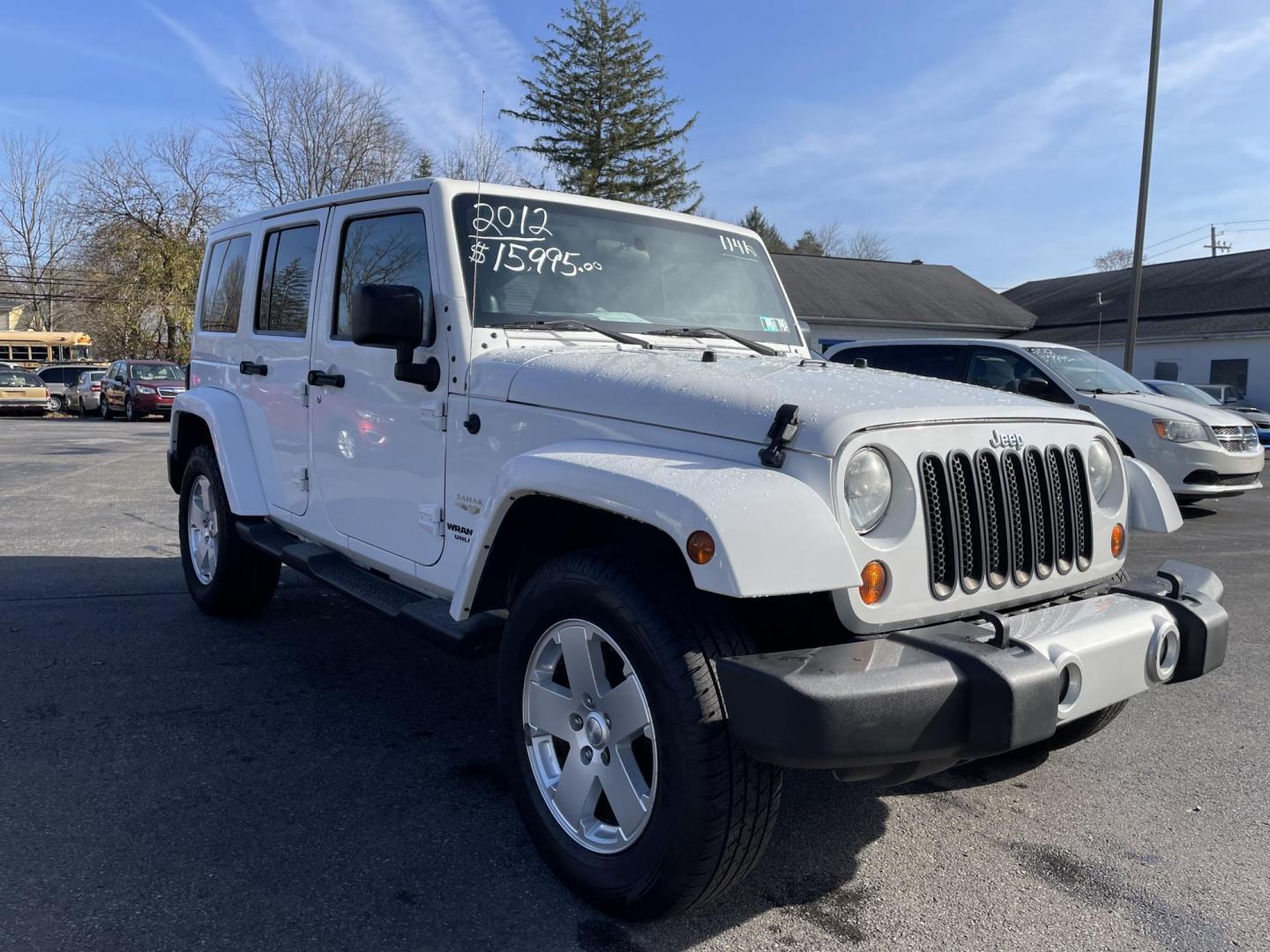 2012 Jeep Wrangler Unlimited Sahara 4WD (1C4BJWEG7CL) with an 3.6L V6 DOHC 24V FFV engine, located at 101 N. Main Street, Muncy, PA, 17756, (570) 546-5462, 41.207691, -76.785942 - Photo#1