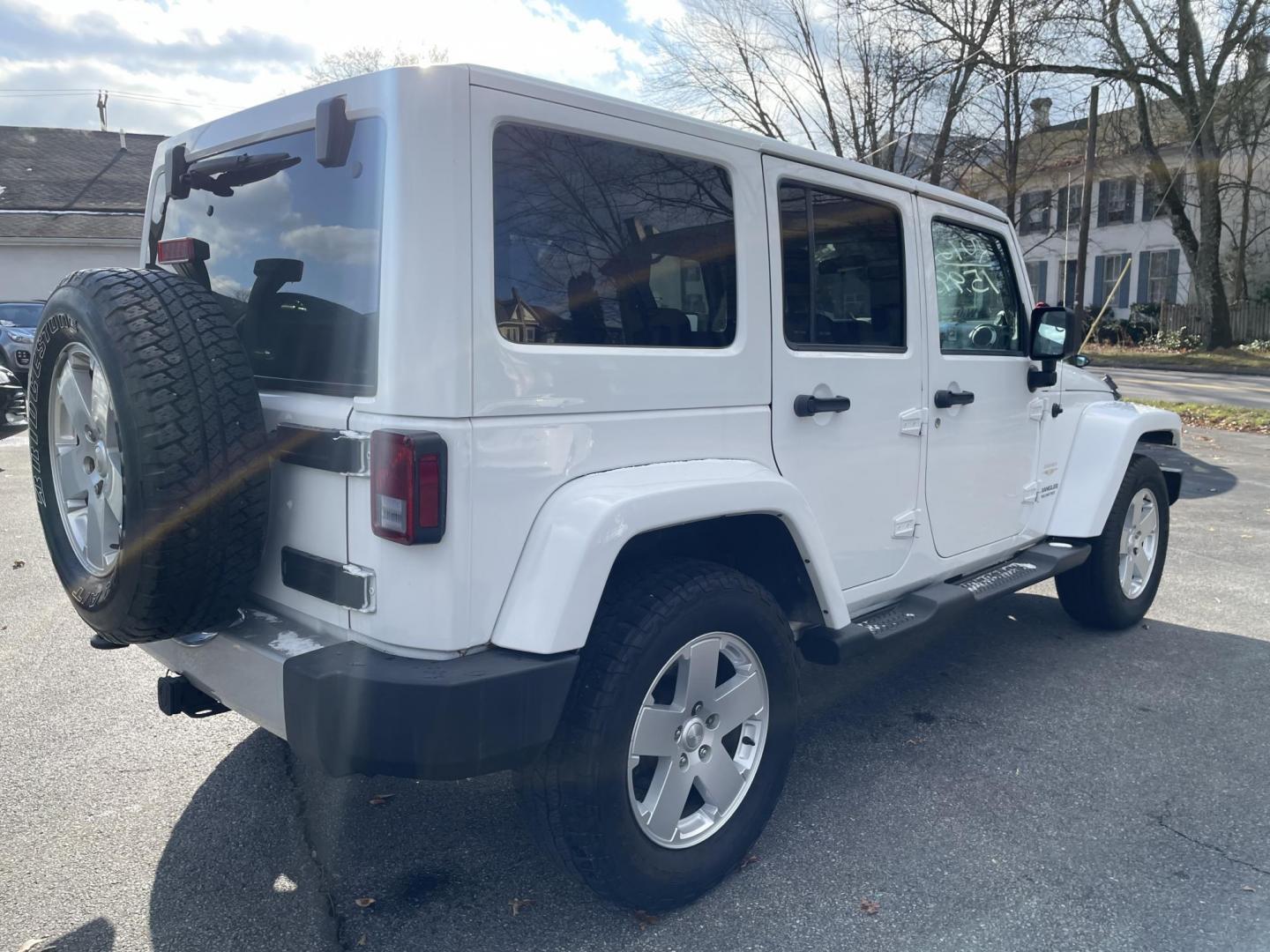 2012 Jeep Wrangler Unlimited Sahara 4WD (1C4BJWEG7CL) with an 3.6L V6 DOHC 24V FFV engine, located at 101 N. Main Street, Muncy, PA, 17756, (570) 546-5462, 41.207691, -76.785942 - Photo#4