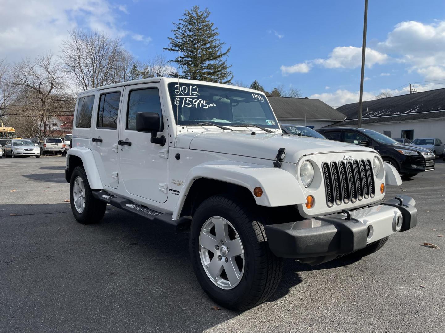 2012 Jeep Wrangler Unlimited Sahara 4WD (1C4BJWEG7CL) with an 3.6L V6 DOHC 24V FFV engine, located at 101 N. Main Street, Muncy, PA, 17756, (570) 546-5462, 41.207691, -76.785942 - Photo#1